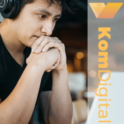 Person with headphones on thinking, KomDigital logo