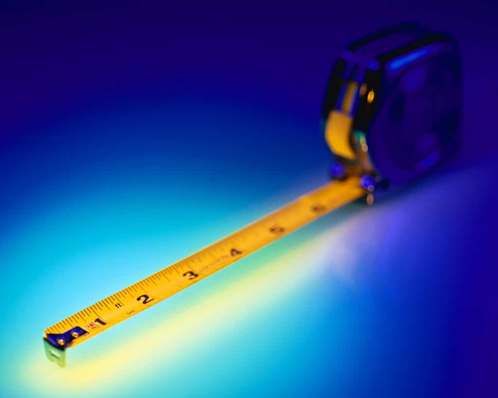 Measuring Tape on blue background - lean learning
