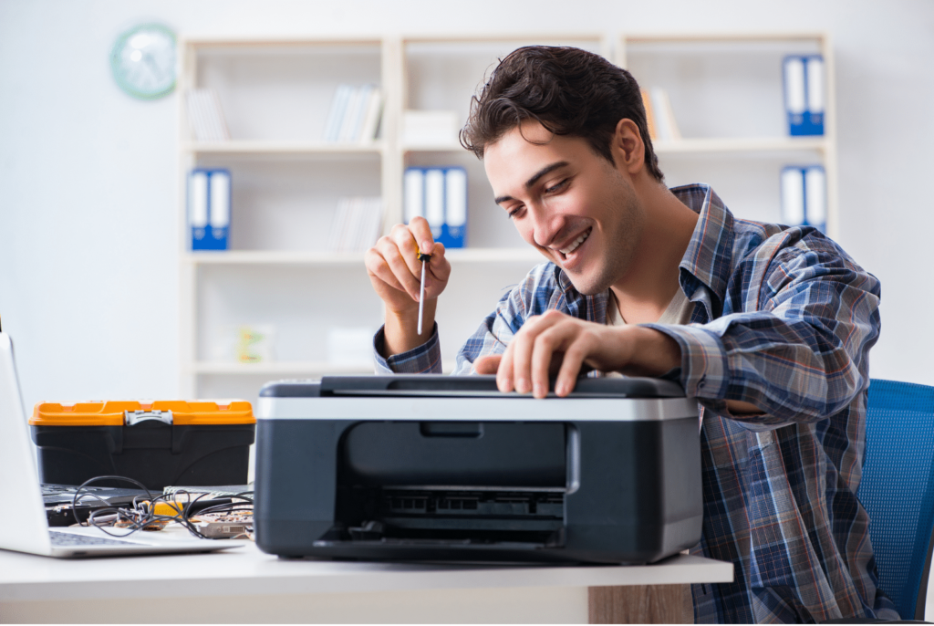 man repairing printer from video learning guidance